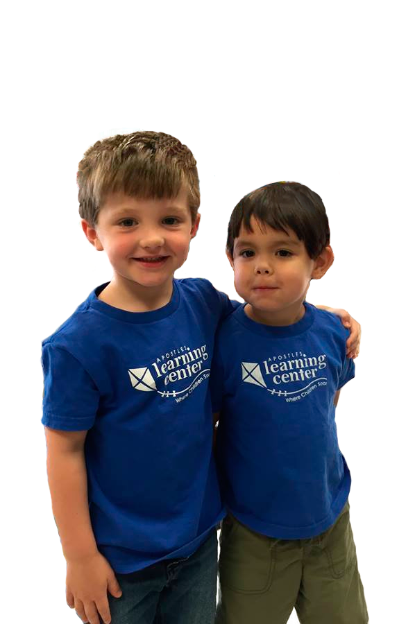 Two boys standing together Apostles Learning Center
